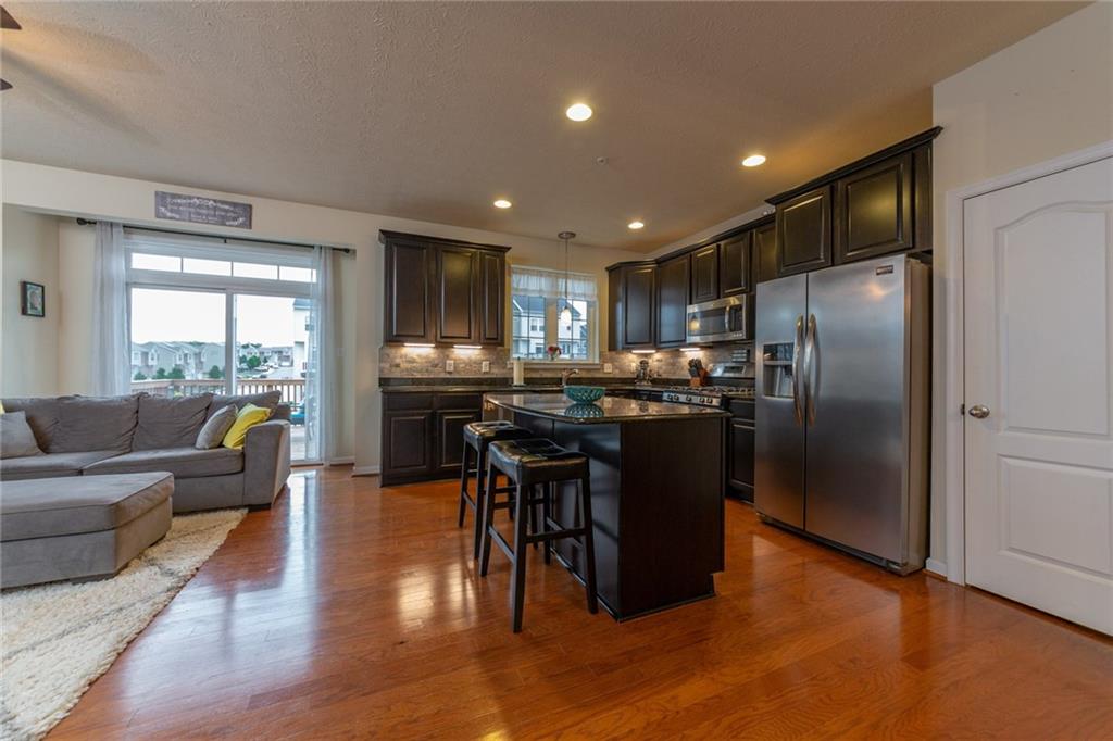 29 Truman Circle McKees Rocks, PA 15136 - Photo 5 of 24 The fully equipped kitchen offers all upgraded cabinetry, granite counters, a tile backsplash and all stainless appliances.