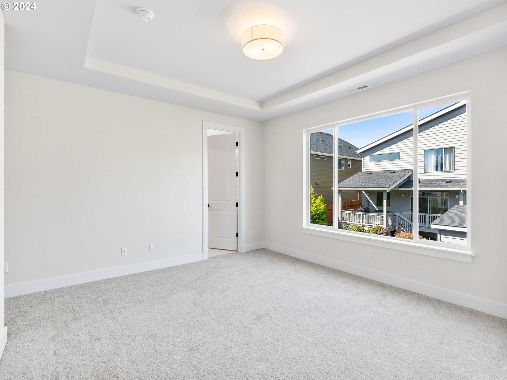16911 Southeast Siri Loop Damascus, OR 97089 - Photo 11 of 21 an empty room with a window