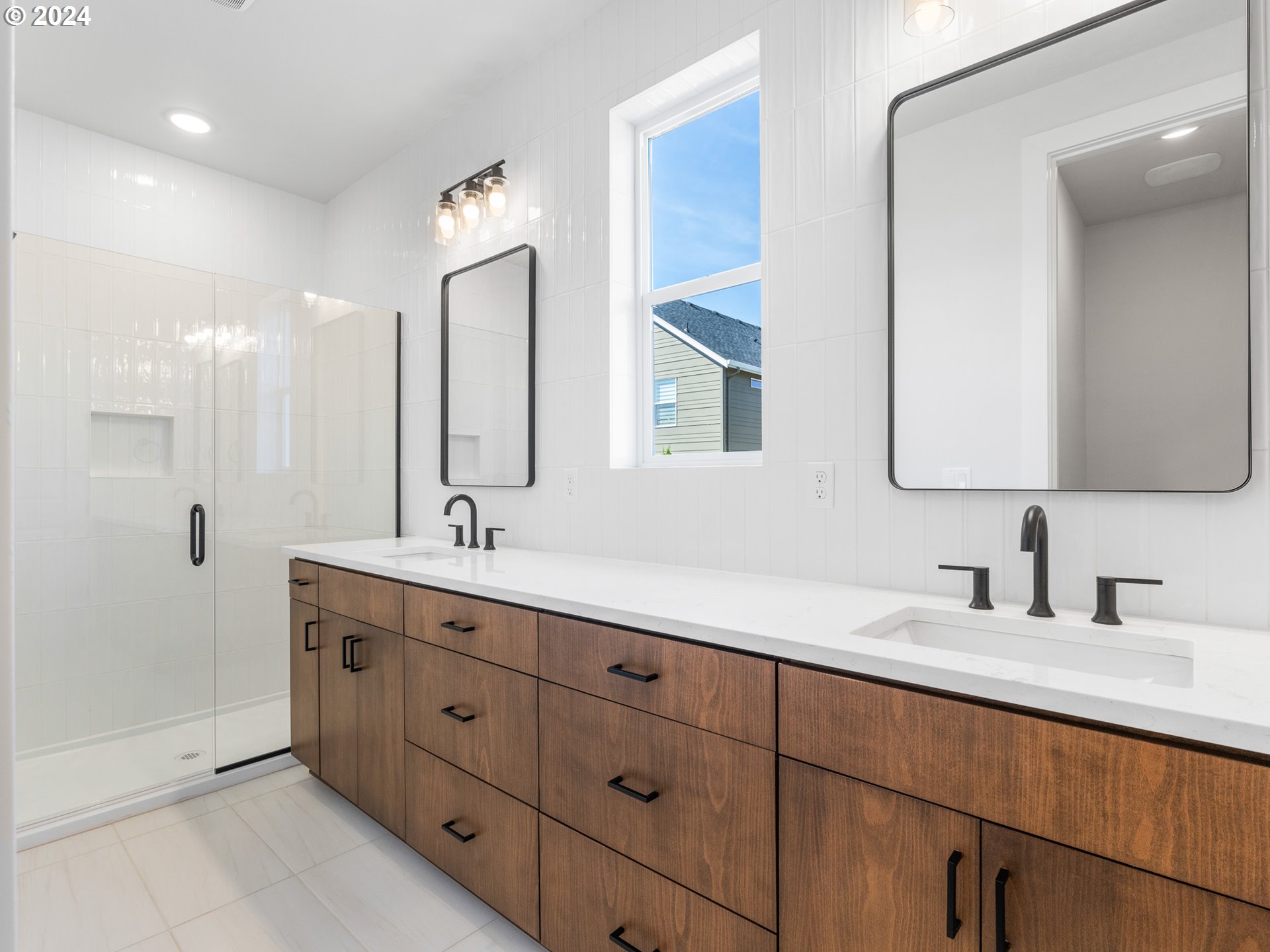 16911 Southeast Siri Loop Damascus, OR 97089 - Photo 12 of 21 a bathroom with a double vanity sink and mirror