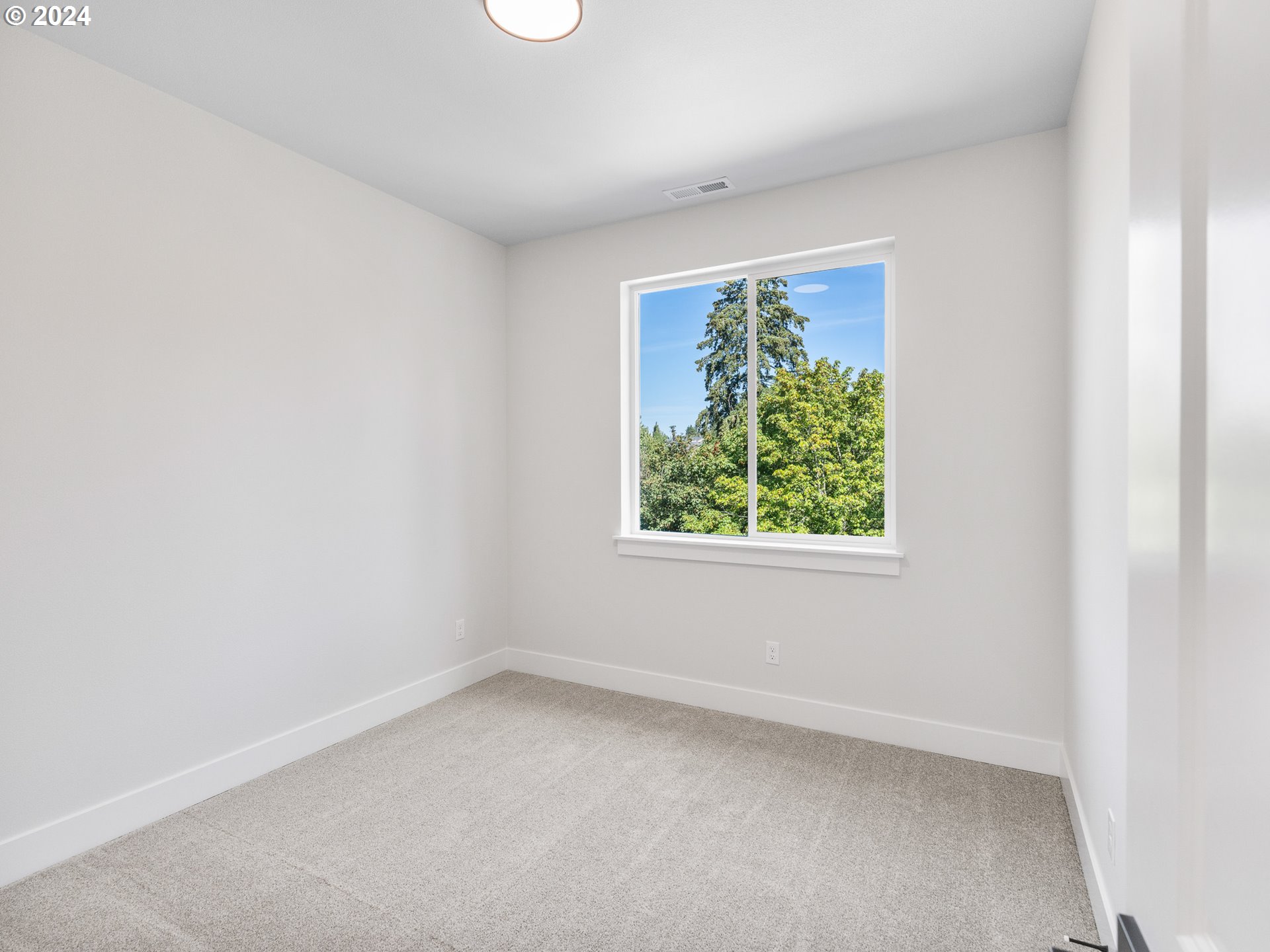 16911 Southeast Siri Loop Damascus, OR 97089 - Photo 14 of 21 an empty room with a window
