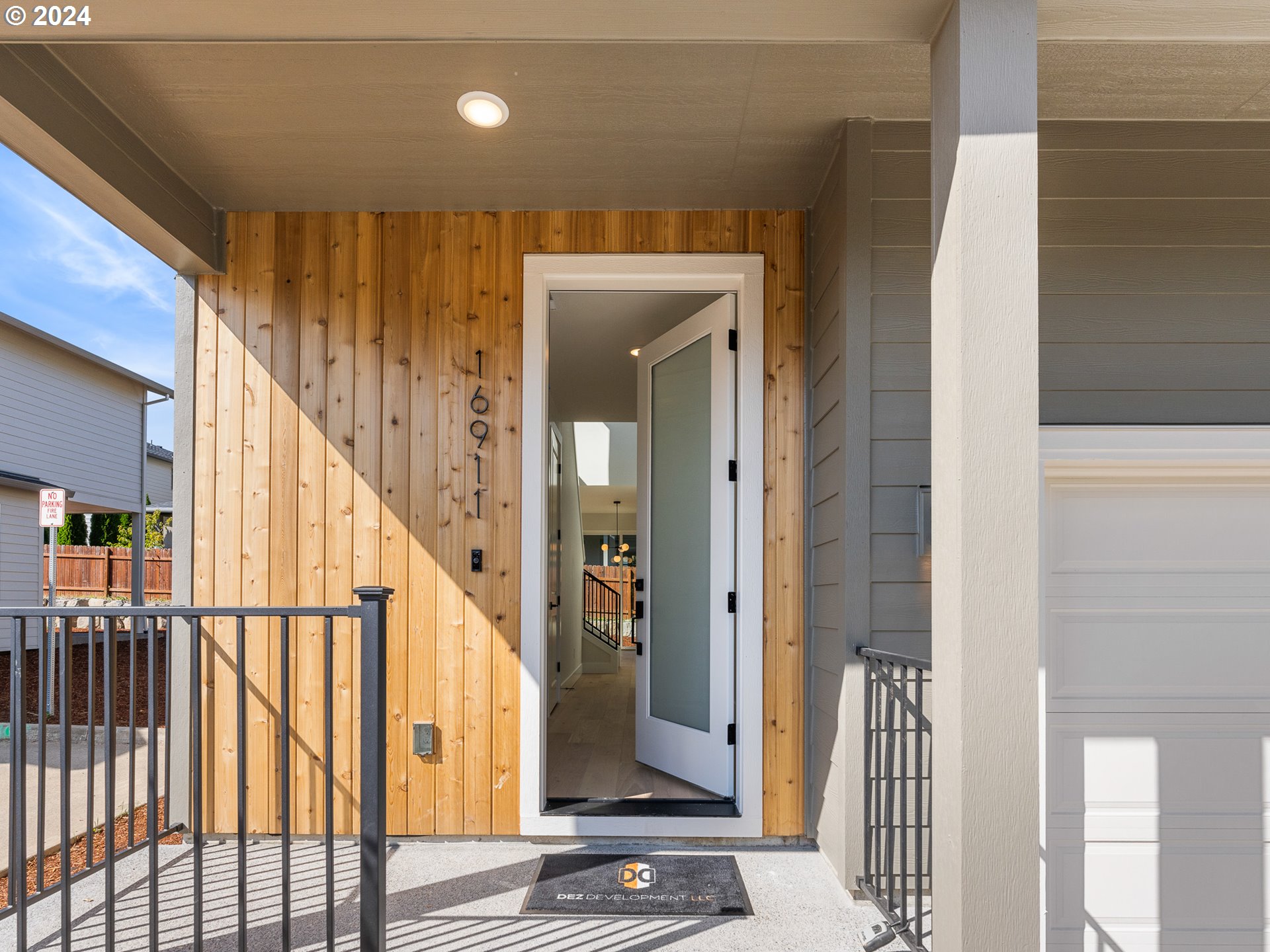 16911 Southeast Siri Loop Damascus, OR 97089 - Photo 2 of 21 a view of staircase with wooden floor and windows