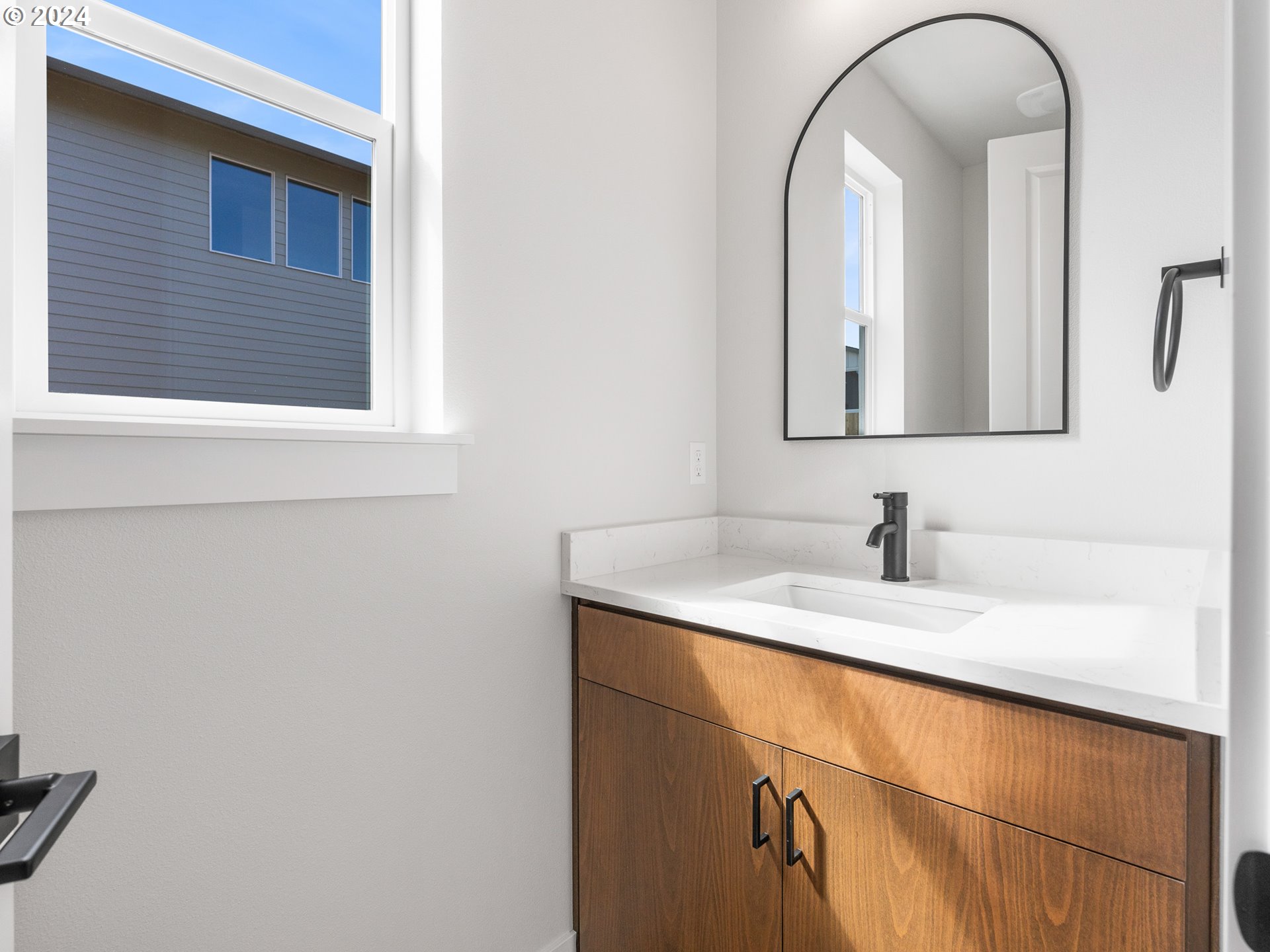 16911 Southeast Siri Loop Damascus, OR 97089 - Photo 9 of 21 a bathroom with a granite countertop sink a mirror and