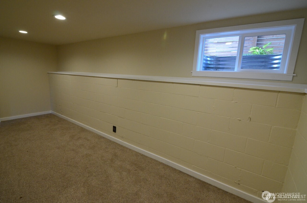 1409 Northwest 65th Street, Unit 3 Seattle, WA 98117 - Photo 15 of 23 an empty room with a window