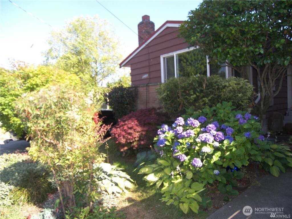 1409 Northwest 65th Street, Unit 3 Seattle, WA 98117 - Photo 2 of 23 a flower garden view