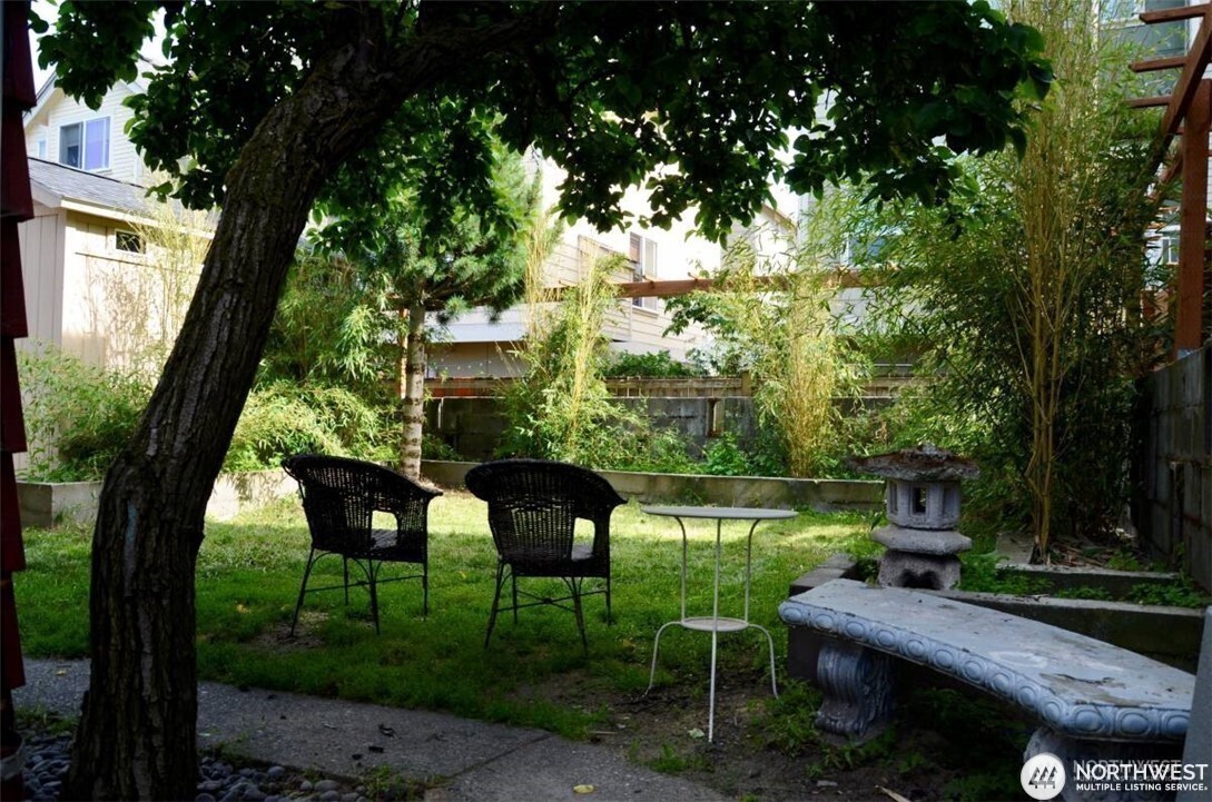 1409 Northwest 65th Street, Unit 3 Seattle, WA 98117 - Photo 22 of 23 a view of a chairs and table in the yard