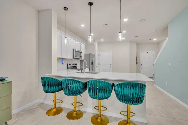 a kitchen with lots of counter space and gym equipment
