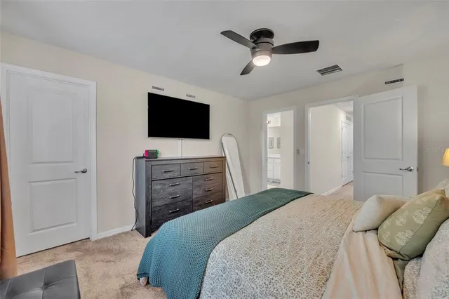 a spacious bathroom with a double vanity sink and a mirror