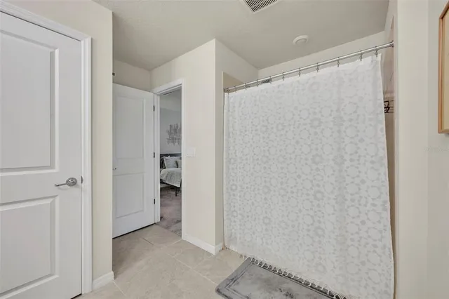 a bedroom with a bed and cabinets