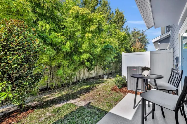a view of a patio in a backyard
