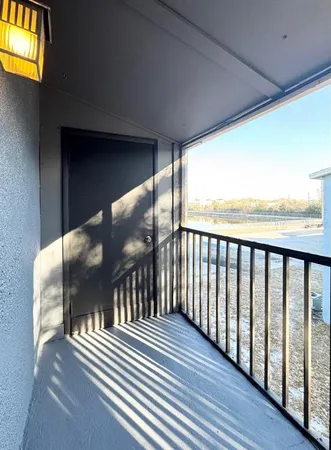 a view of a swimming pool with sitting area