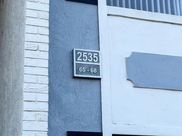 a view of water with boats and trees in the background