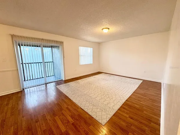 an empty room with wooden floor