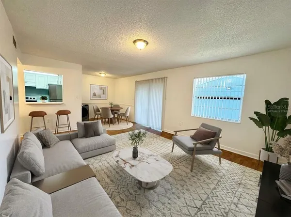 a living room with furniture and a rug