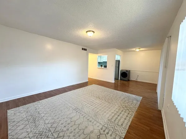 a view of hallway with wooden floor