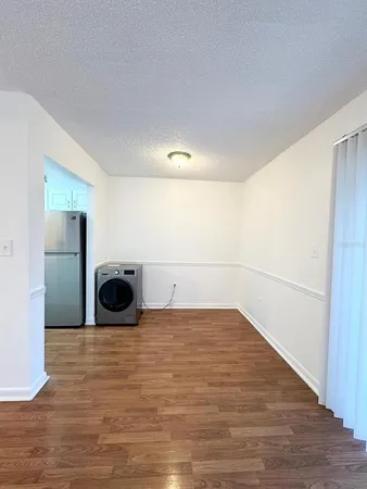 a view of a livingroom with wooden floor