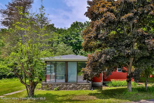a view of a house with a yard
