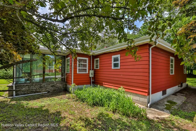 a view of a big yard with large trees