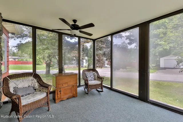 a view of a room with gym equipment and floor to ceiling window