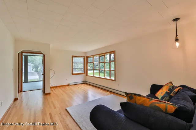 a living room with a couch and a large window