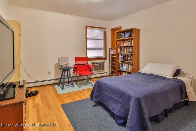 a view of livingroom with hardwood floor and windows