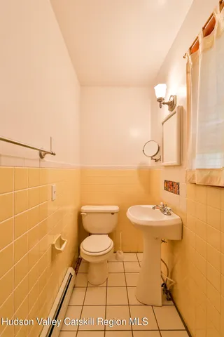 a view of a living room and bathroom