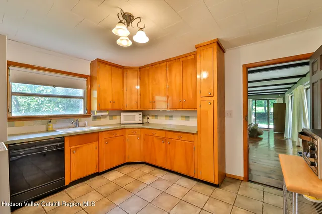 a kitchen with stainless steel appliances granite countertop a refrigerator sink and cabinets