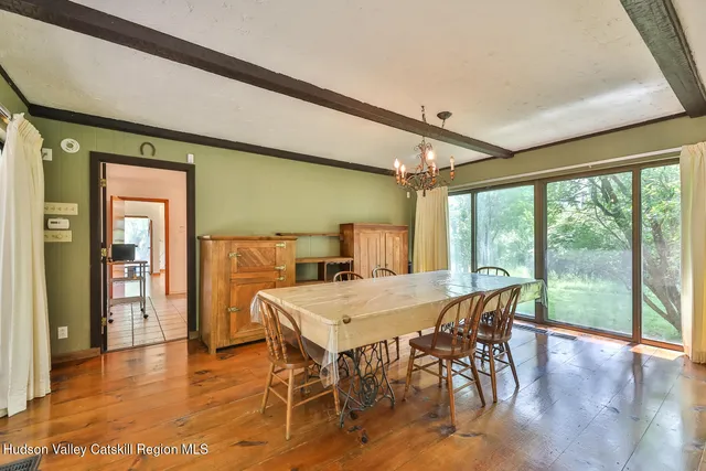 a view of a living room and bedroom
