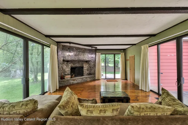 a bathroom with a toilet a sink and shower