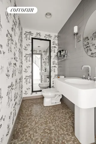 a spacious bedroom with a balcony a bed and a fireplace