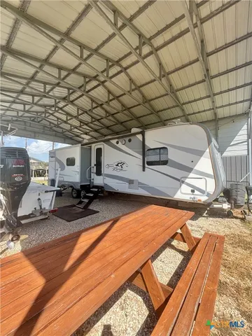 a view of a backyard with seating area