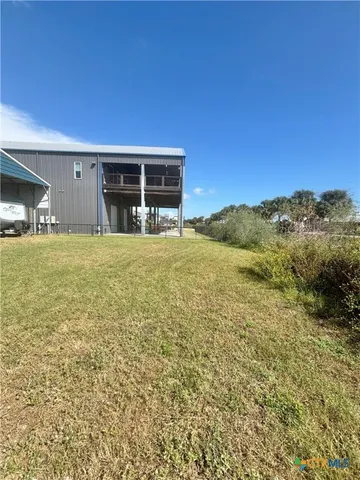 a view of large trees with an outdoor space
