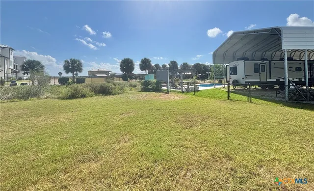 a view of a swimming pool and a chairs