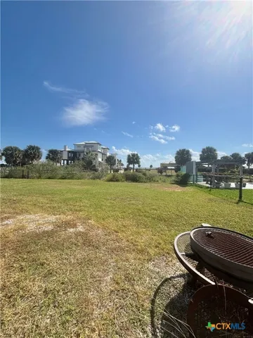 a view of a lake with a yard
