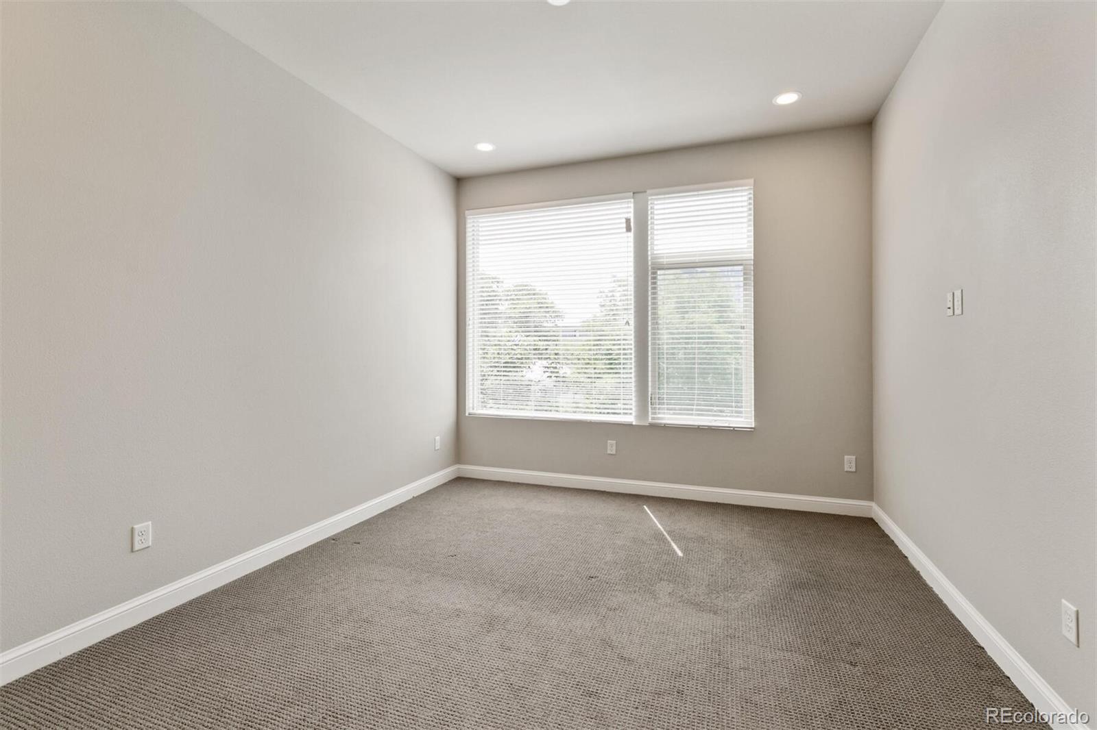 1014 Acoma Street Denver, CO 80204 - Photo 20 of 35 an empty room with a window