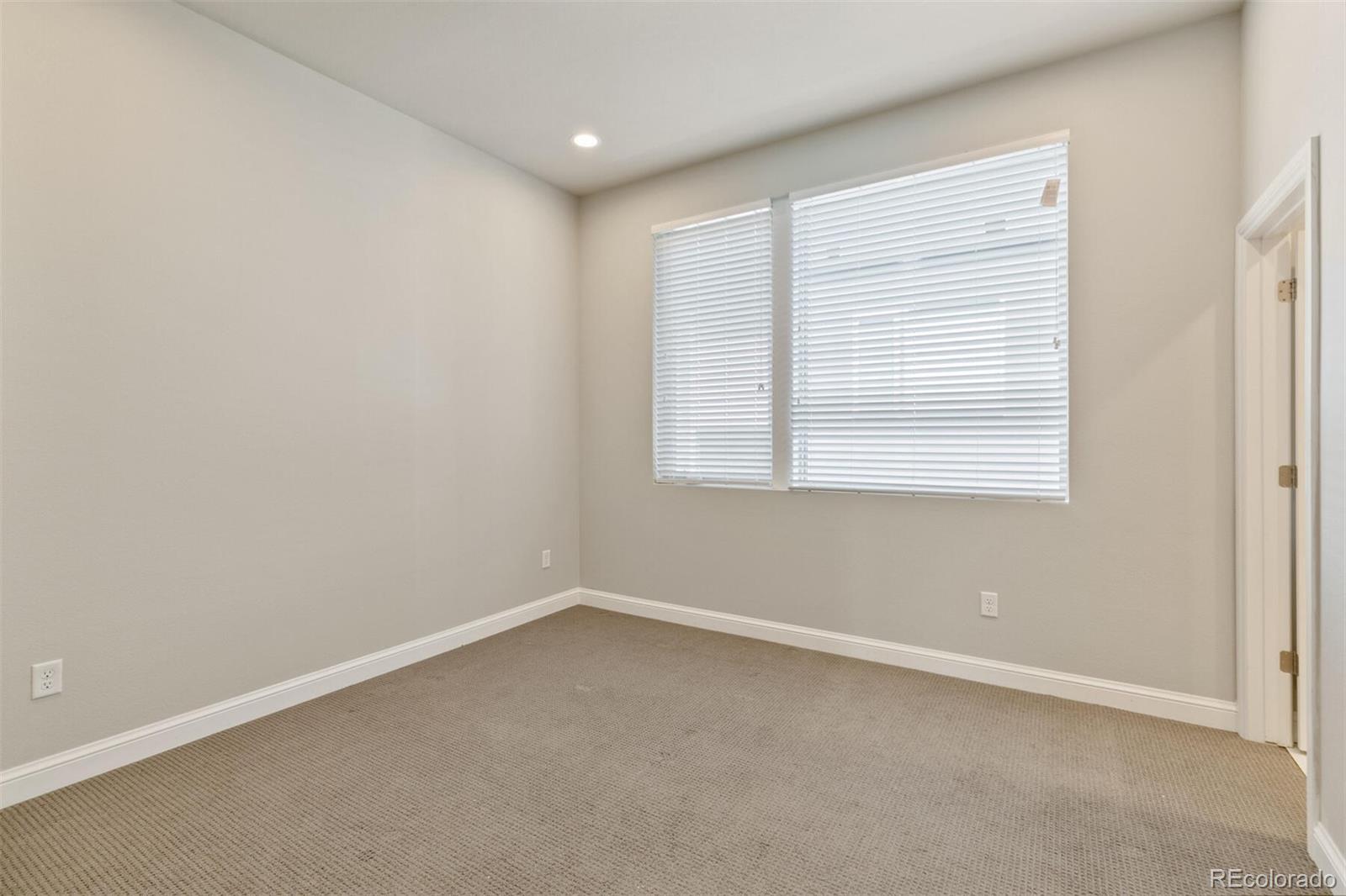 1014 Acoma Street Denver, CO 80204 - Photo 24 of 35 an empty room with a window
