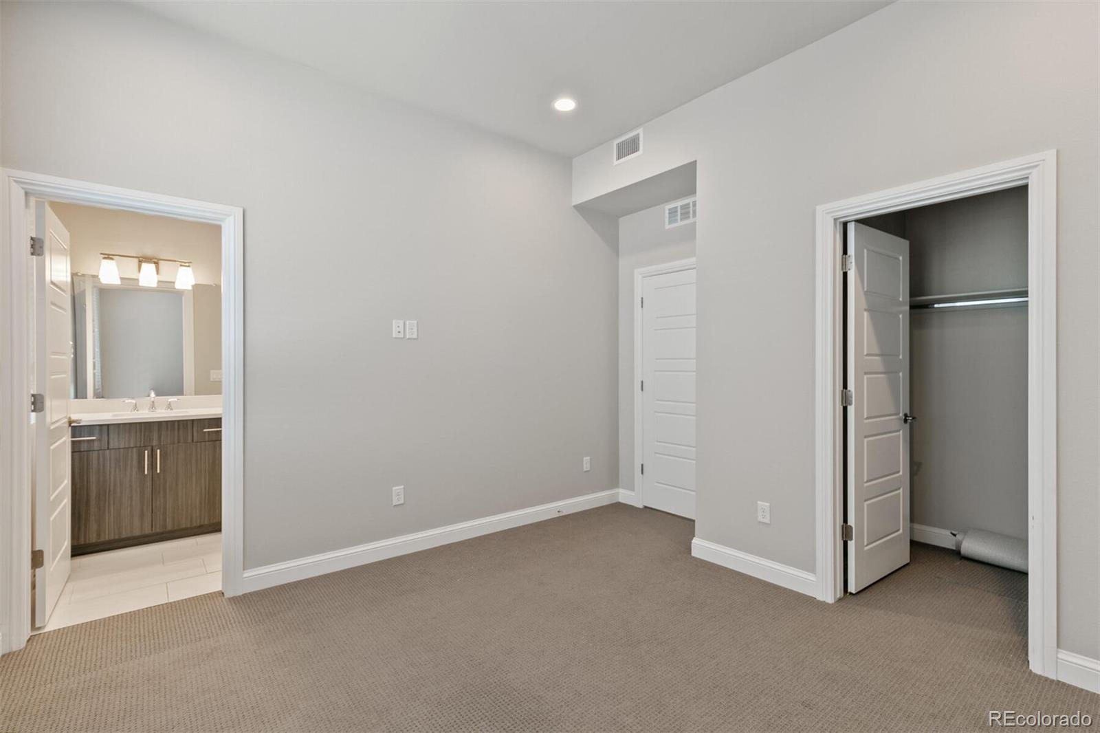 1014 Acoma Street Denver, CO 80204 - Photo 25 of 35 a view of an empty room with closet and a window