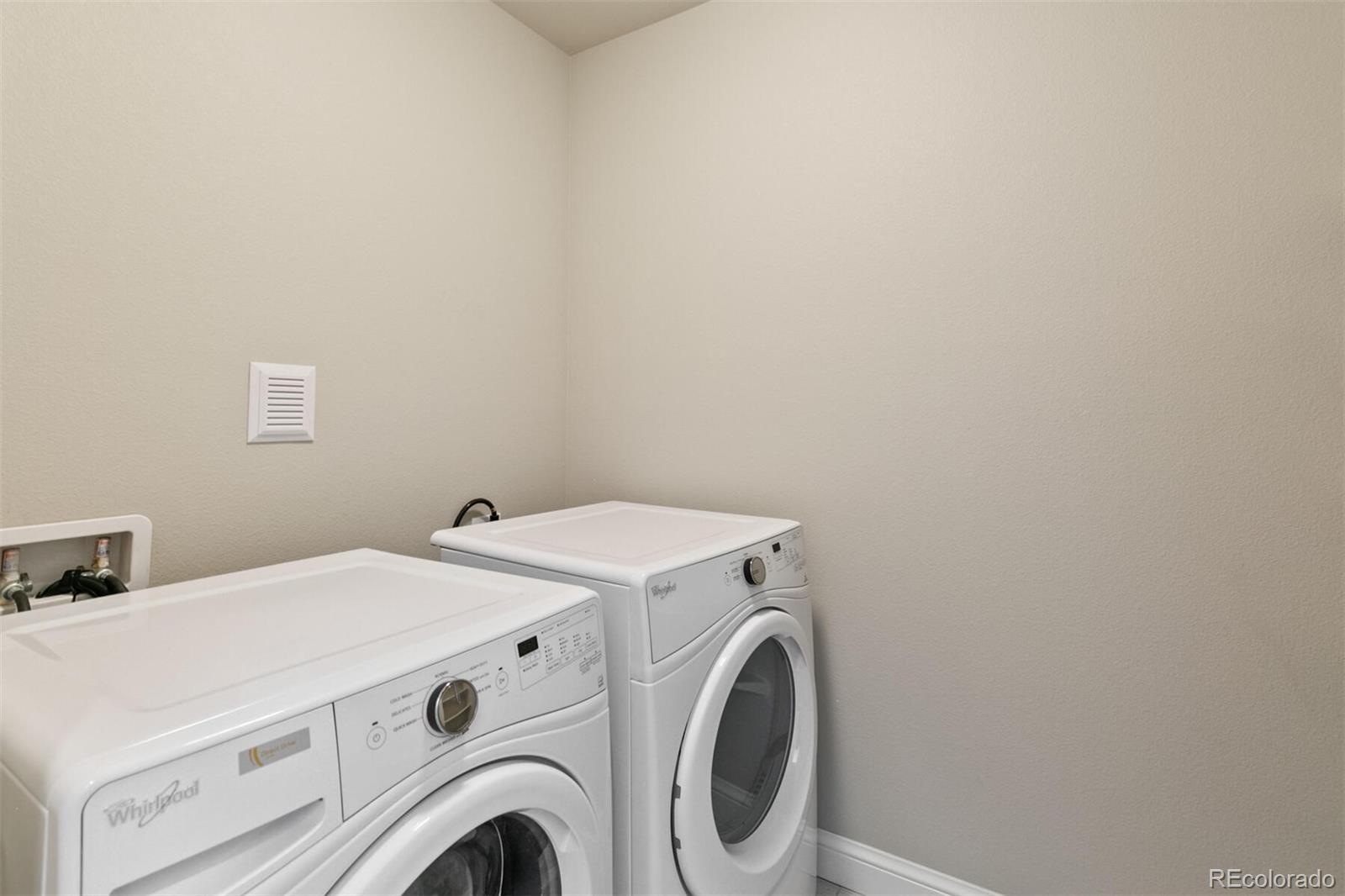 1014 Acoma Street Denver, CO 80204 - Photo 27 of 35 a utility room with dryer and washer