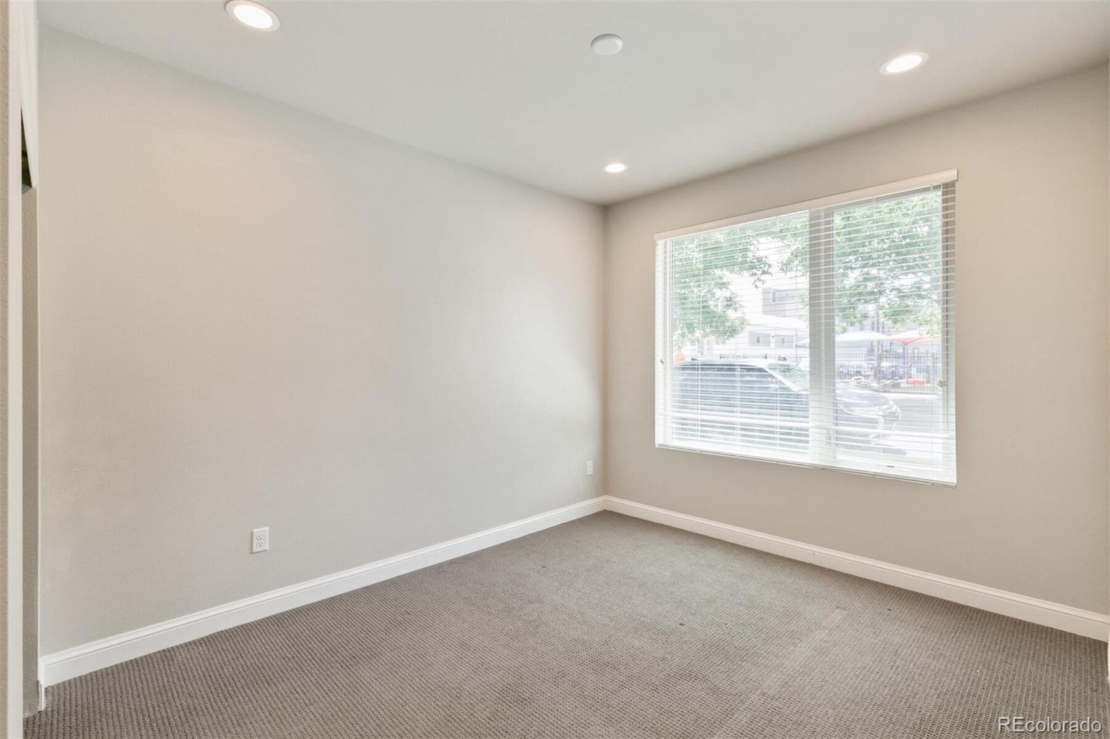 1014 Acoma Street Denver, CO 80204 - Photo 7 of 35 an empty room with a window