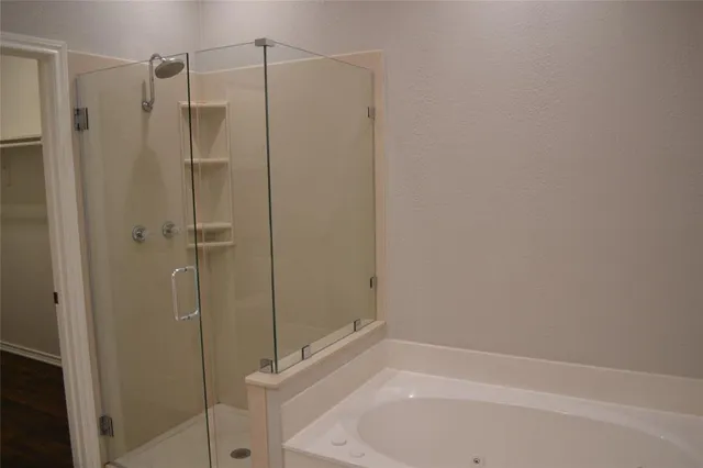 a bathroom with a shower and a toilet