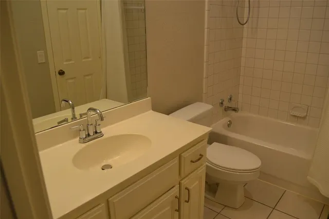 an empty room with wooden floor and a window