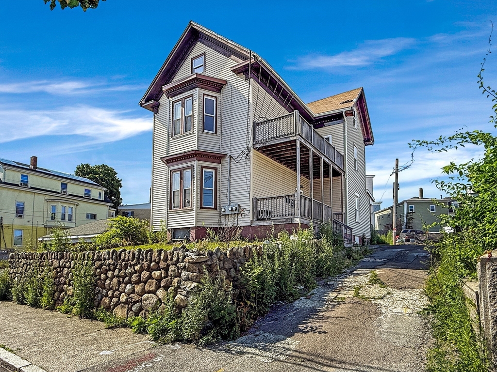 19 High Street Lynn, MA 01902 - Photo 1 of 42 a front view of a house with a yard