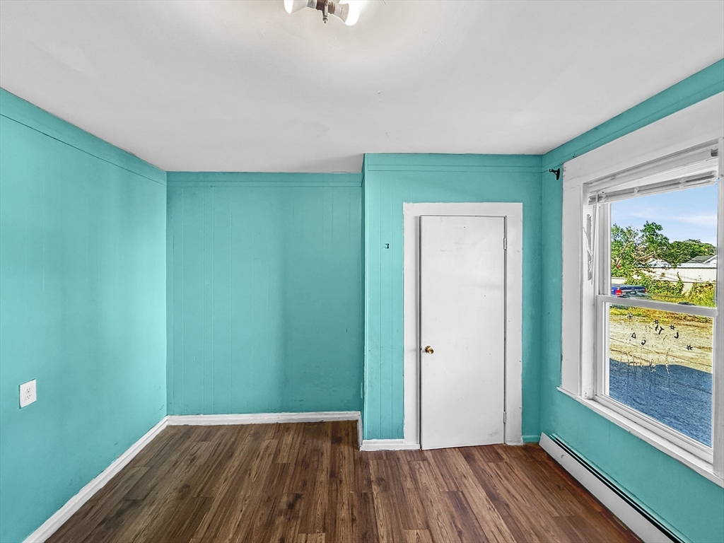 19 High Street Lynn, MA 01902 - Photo 13 of 42 a view of a room with wooden floor and windows
