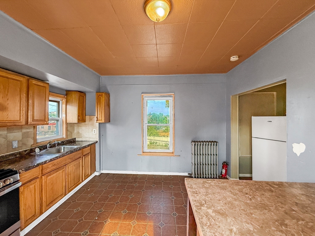 19 High Street Lynn, MA 01902 - Photo 22 of 42 a view of a kitchen with windows