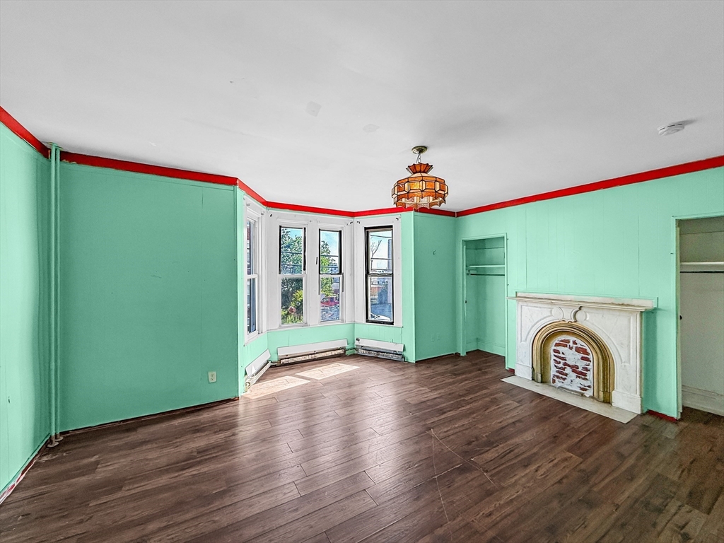 19 High Street Lynn, MA 01902 - Photo 3 of 42 a view of empty room with window and wooden floor
