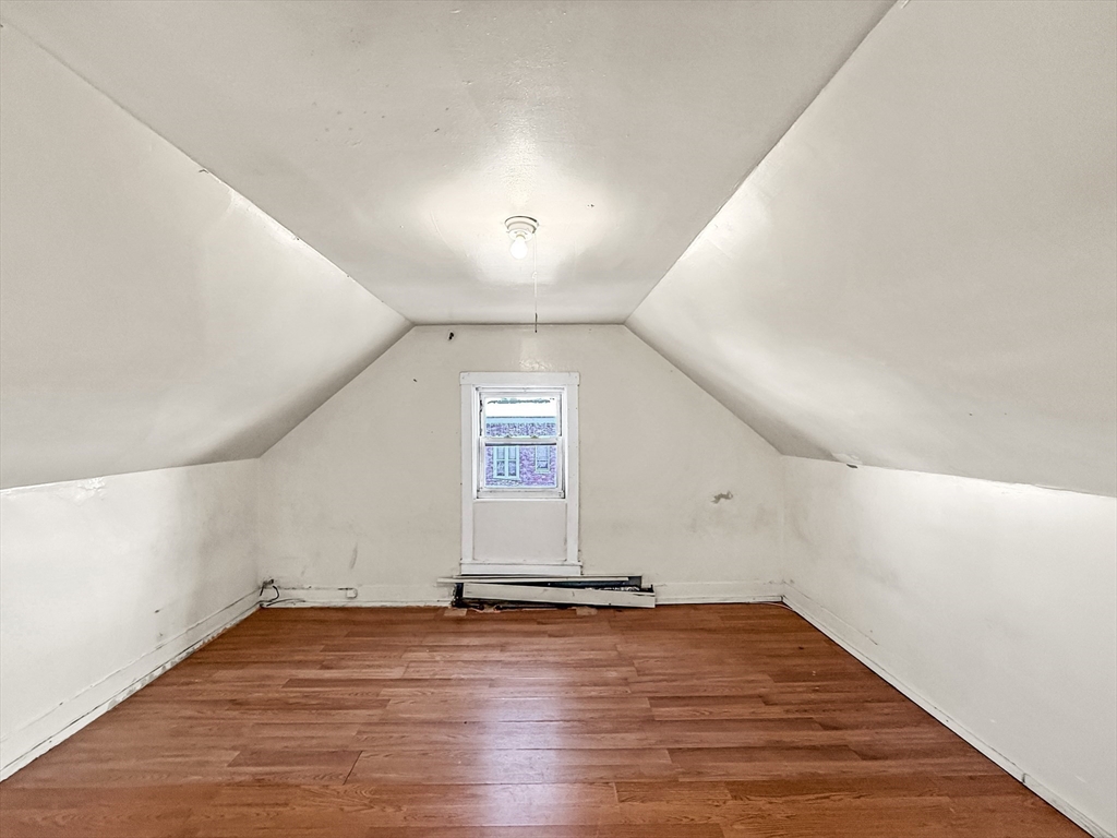 19 High Street Lynn, MA 01902 - Photo 35 of 42 an empty room with wooden floor and windows