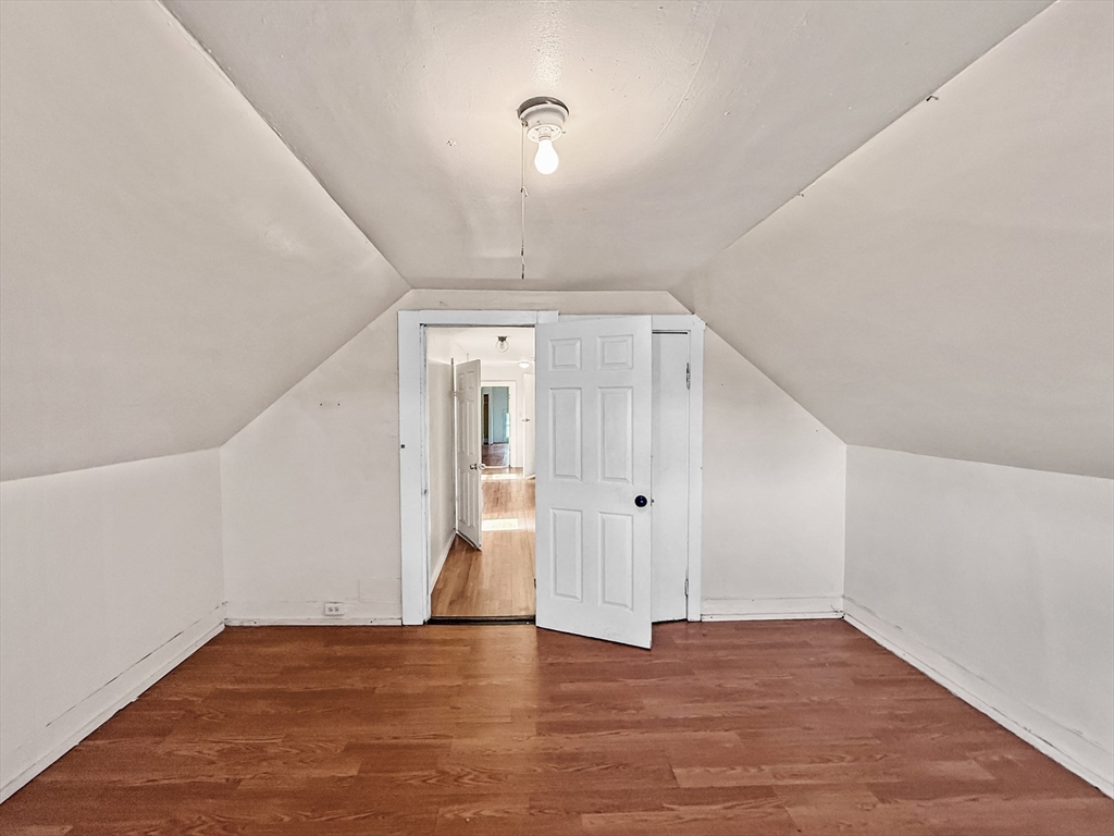 19 High Street Lynn, MA 01902 - Photo 36 of 42 a view of an empty room with wooden floor and a window