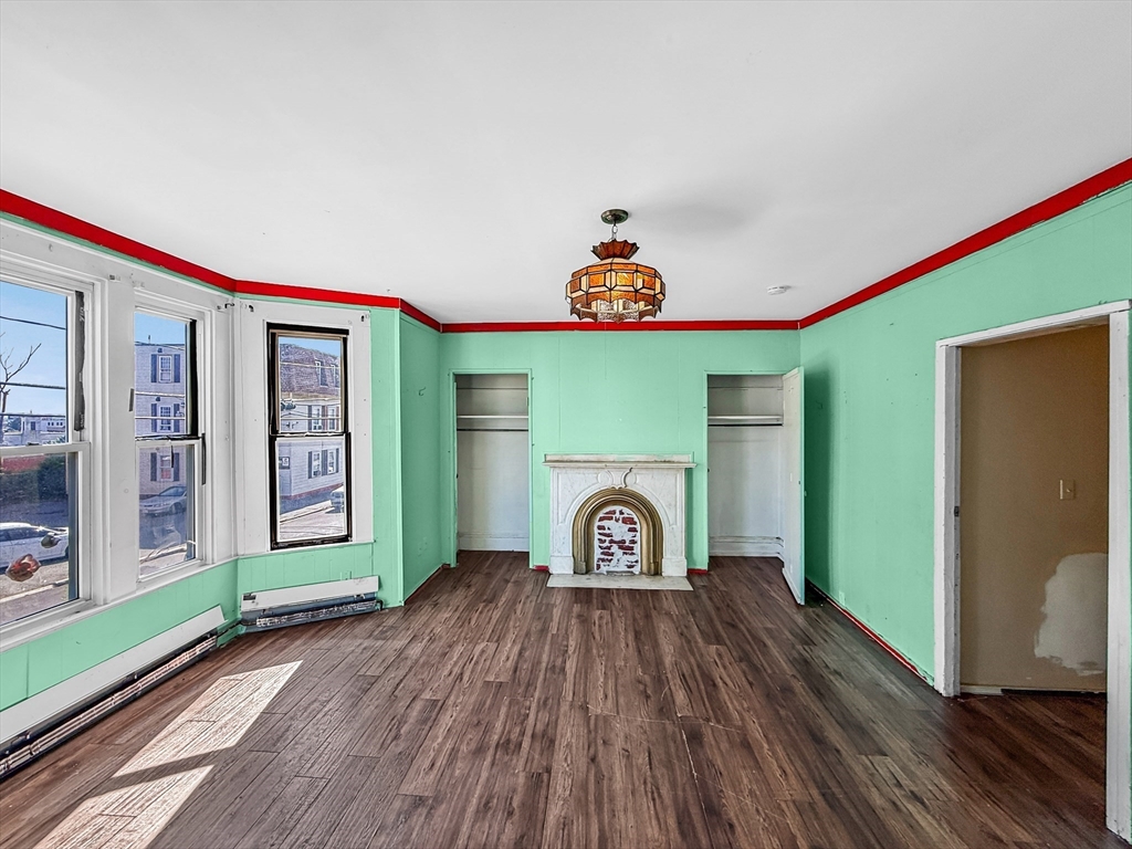 19 High Street Lynn, MA 01902 - Photo 4 of 42 a view of empty room with wooden floor