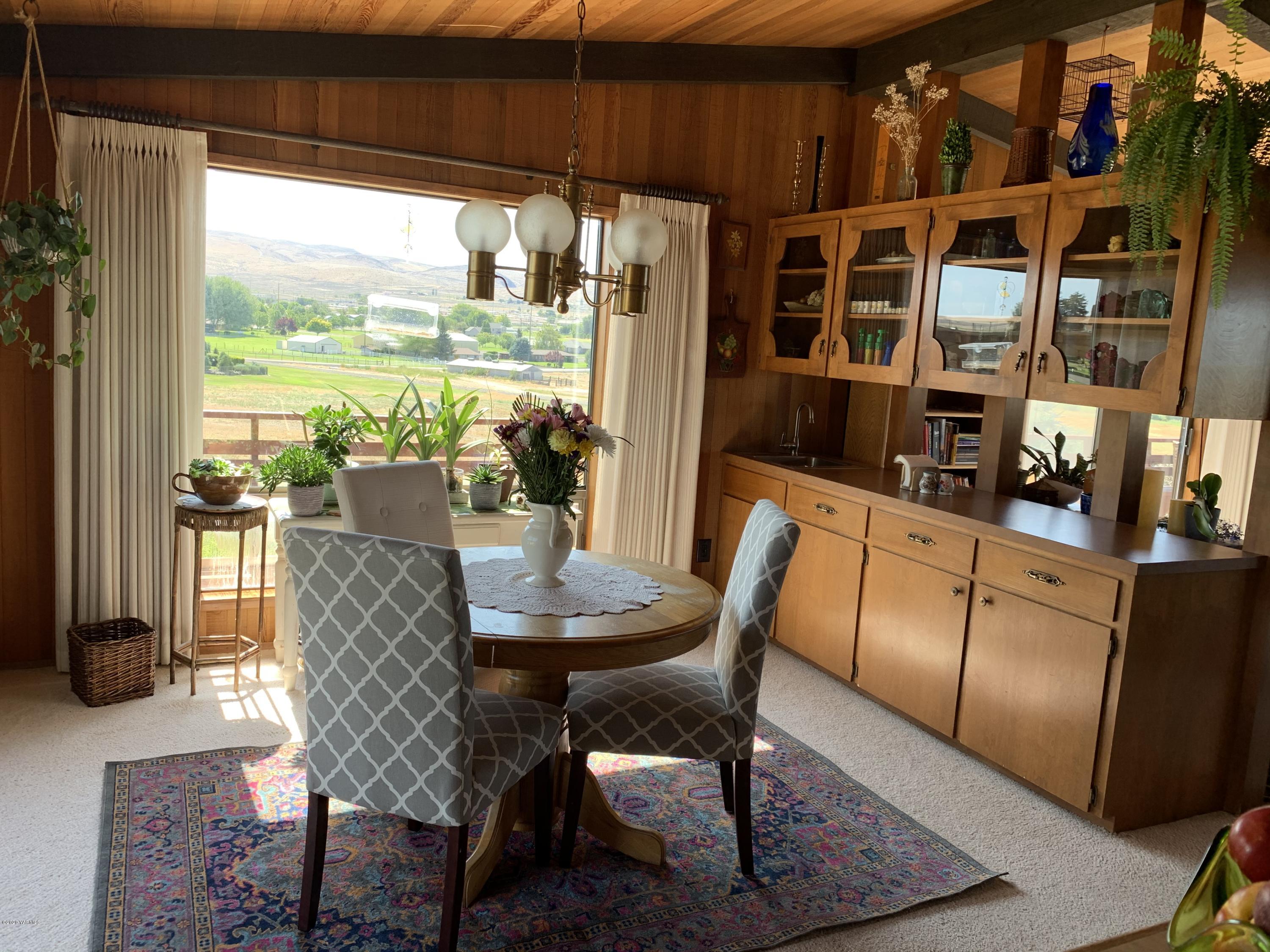 480 Pomona Heights Road Yakima, WA 98901 - Photo 36 of 39 a view of a dining room with furniture window and outside view
