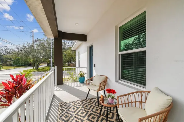 a balcony with furniture and garden view