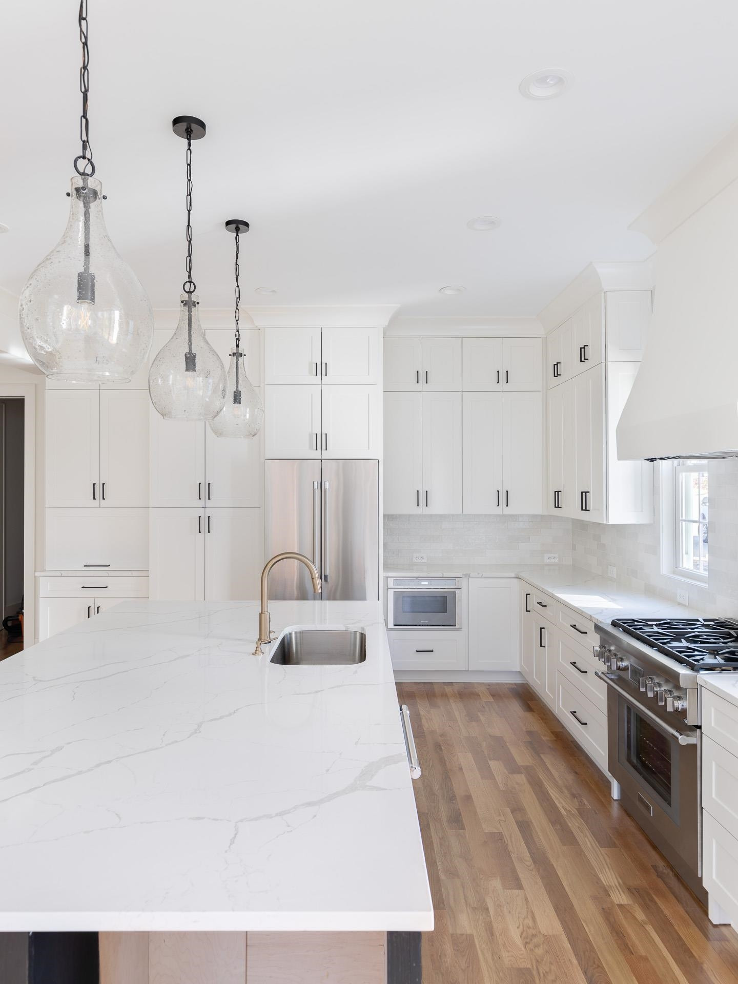 6312 Stephens Ridge Raleigh, NC 27615 - Photo 12 of 28 a large white kitchen with stainless steel appliances